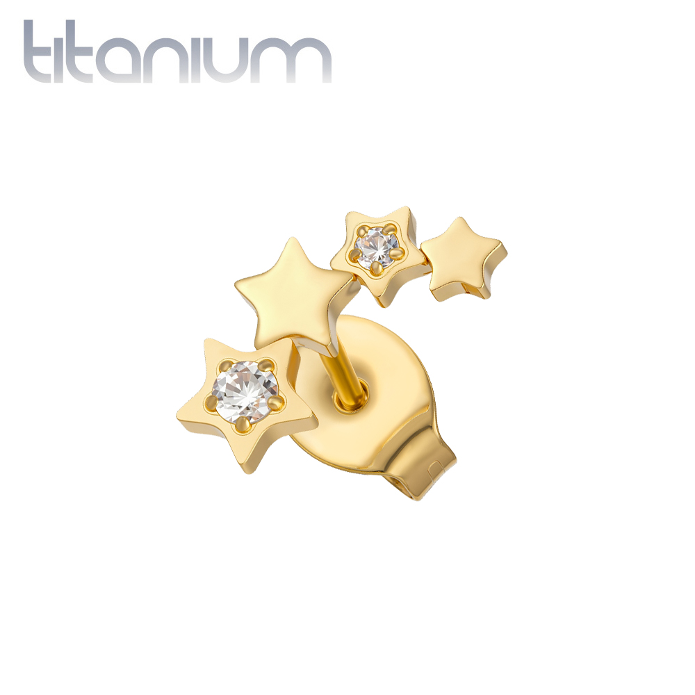 עגיל סטד בודד מטיטניום וציפוי זהב - כוכבים עם קריסטלים לבנים